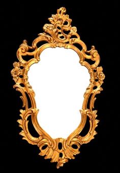 an ornate gold framed mirror against a black background