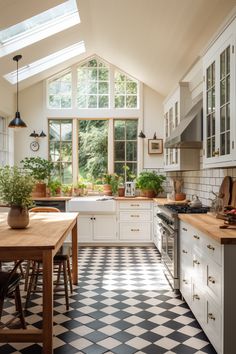 a kitchen with black and white checkered flooring, large windows, potted plants on the counter