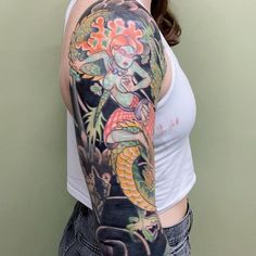 a woman with a dragon tattoo on her arm