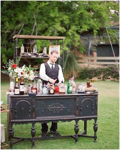 a man standing at a table with drinks on it and the words martha weddings