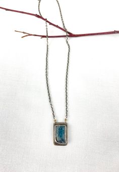 I openly admit, Kyanite is one of my favorite gemstones. That denim blue that comes in so many shades - all of them irresistible (in my opinion). Encased in a handcrafted setting of sterling silver with a soft gray patina, this stone hangs from a silver chain made in Bali. This necklace is a keeper! Approximately 19.5 inches long with a silver toggle clasp. Free Shipping in the USA! Shipped in a gift box ready for giving. Due to the custom nature of these earrings, no two are alike. Slight varia Blue Oxidized Necklace For Gift, Blue Oxidized Finish Necklace For Gift, Blue Oxidized Pendant Jewelry, Blue Sterling Silver Jewelry With Oxidized Finish, Blue Oxidized Sterling Silver Jewelry, Unique Blue Necklace With Patina, Artisan Blue Jewelry With Oxidized Finish, Blue Sterling Silver Jewelry With Patina, Blue Patina Sterling Silver Jewelry