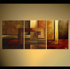 an abstract painting with gold, brown and red colors on the wall in a living room