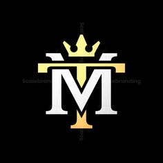 the letter m with a crown on top is shown in gold and white letters that spell out