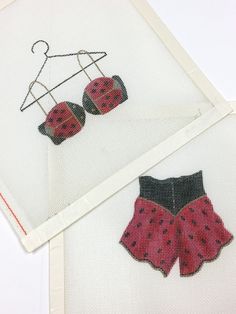 two pieces of fabric with ladybugs on them and one piece of clothing hanging from a clothes hanger