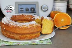 an orange cake is on a plate with a slice cut out and ready to be eaten