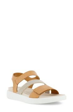 Chic mixed-media straps pair with a pillowy raised footbed to lend a streamlined futurism to this sporty sandal. Adjustable hook-and-loop straps Leather and textile upper/leather lining/synthetic sole Imported