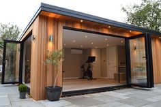 a small wooden building sitting on top of a patio