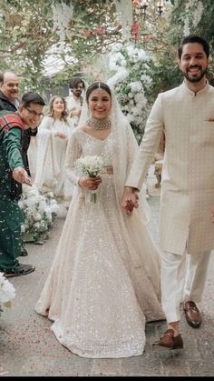 the bride and groom are walking down the aisle