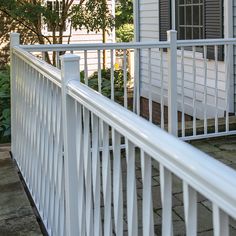 a white railing on the outside of a house