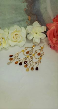 Beautiful Carnelian and 14K Gold Filled Teardrop Gemstone Chandelier Earrings. They are elegant and dangly with a Bohemian twist. Handmade of high quality 14 karat gold filled wire, 14 karat gold filled chain with carnelian teardrop gemstones. These earrings have classic lines and are perfect for day wear or a special evening out. These Carnelian Gemstones (approx stone size is 9.95mm x 6.64 mm )are in complementary shades of cream and peaches on 14K Gold Filled wire. Uniquely created, Handmade Bohemian Amber Drop Earrings, Bohemian Teardrop Chandelier Earrings With Natural Stones, Amber Dangle Earrings With Natural Stones, Bohemian Chandelier Dangle Earrings With Natural Stones, Bohemian Teardrop Amber Jewelry, Bohemian Amber Teardrop Jewelry, Bohemian Long Drop Chandelier Earrings, Bohemian Amber Earrings With Ear Wire, Bohemian Wire Wrapped Long Drop Chandelier Earrings