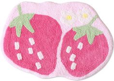 a pink rug with two strawberries on the front and one strawberry on the back