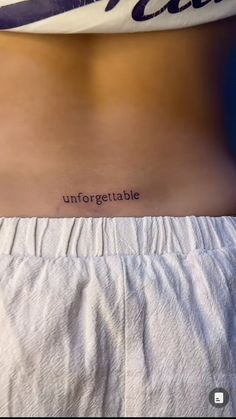 a woman's stomach with the word unforttable written on it, in cursive font