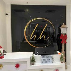 the front window of a boutique with christmas decorations