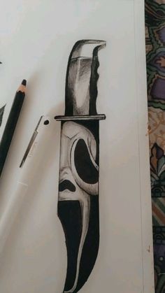 a pencil drawing of a knife with a face on it's blade and another piece of art next to it