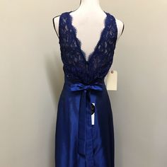 a blue dress with lace on the back