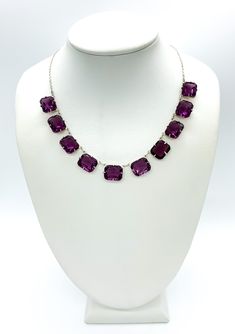 "Antique Art Deco Sterling Silver Amethyst Paste Rhinestone Riviere Necklace 15\" Up for offer is a beautiful antique art deco 1920s solid sterling silver and cushion cut amethyst paste rhinestone riviere necklace.  This necklace features a spring ring clasp.  Necklace is marked \"Sterling\". Time Period: 1920s Measurements Necklace Length: 15\" Chain Width: 1.5mm Amethyst Paste Rhinestones: 12mm x 9mm x 5.7mm Weight: 19.1 g Materials -Sterling Silver -Paste Rhinestone Condition: Excellent; item is pre-owned and may have some signs of light use.  Please inspect pictures for overall condition. This item comes from a clean, smoke free household.  Item will ship within 24-48 hours of sale.  Returns are accepted within 14 days.  There is a 7% restocking return fee for this item.  Please send a Purple Gemstone Necklace For Party, Formal Amethyst Necklaces With Stones, Purple Crystal Jewelry With Stones, Purple Crystal Necklaces With Jewels, Purple Crystal Gemstone Necklace, Riviere Necklace, 1920s Necklace, Necklace Art Deco, Art Deco 1920s