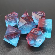 several blue and red dice sitting on top of a table