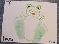 a child's hand and foot print with the word frog written on it in green