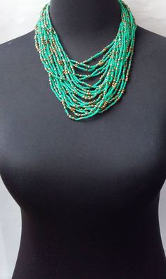 African beaded necklace made with the finest beads. Its a perfect accessory that will match most of your outfits. Suitable for any season. A good gift to your friends and loved ones. All our items are shipped through DHL Express. Delivered between 3 to 5 days. Turquoise Beaded Necklaces With Spacer Beads, Turquoise Beaded Necklace With Spacer Beads, Elegant Multi-strand Turquoise Beaded Necklaces, Green Beaded Necklace With Faceted Beads, Elegant Turquoise Beaded Necklaces With Spacer Beads, Elegant Turquoise Beaded Necklace With Spacer Beads, Green Turquoise Necklace With Colorful Round Beads, Elegant Turquoise Faceted Beads, Elegant Faceted Turquoise Beads