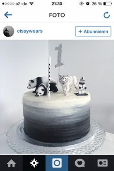 an image of a cake with pandas on top and other animals on the bottom