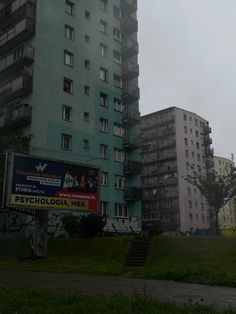 an apartment building in the city with graffiti on it