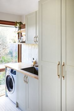 a washer and dryer in a small kitchen