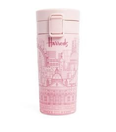 a pink travel mug with the word harrod printed on it's side