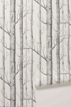 a wallpaper with trees on it and the background is painted in black and white