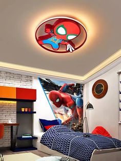 a bedroom with a spiderman mural on the wall