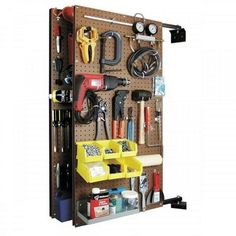 a wall mounted tool rack with tools on it