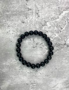 This Shungite Bracelet EMF is the perfect way to protect yourself from harmful electronic radiation. Shungite is a powerful stone known for its ability to absorb and neutralize negative energy, and this bracelet is made with an especially high concentration of Shungite to provide maximum protection. Spiritual Black Hypoallergenic Bracelets, Spiritual Hypoallergenic Black Bracelets, Hypoallergenic Black Spiritual Bracelets, Minimalist Black Bracelet For Meditation, Hypoallergenic Black Bracelets For Meditation, Minimalist Black Bracelets For Meditation, Hypoallergenic Black Beaded Bracelets For Healing, Black Hematite Crystal Bracelet For Spiritual Use, Black Hematite Crystal Bracelet With 8mm Beads