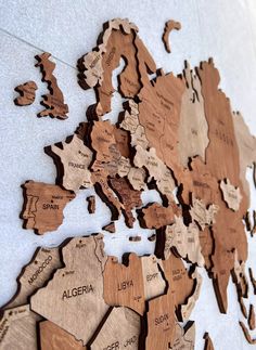 a wooden map of the world with countries