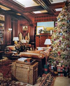 a living room decorated for christmas with a tree in the corner