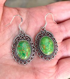 "Natural, Tibetan, copper/green, turquoise gemstone drop/dangle statement earrings, set in sterling silver plated over copper bezel setting. The ear wires are solid Sterling Silver. Total drop length/width: 1.75\" x 0.90\" inches. Stone dimensions: 18mm x 13mm." Green Cabochon Dangle Earrings, Green Oval Hypoallergenic Earrings, Hypoallergenic Green Oval Earrings, Green Cabochon Drop Earrings, Green Oval Nickel-free Earrings, Large Statement Earrings, Turquoise Drop Earrings, Green Copper, Oxidized Silver