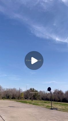 an empty parking lot with a blue sky in the background