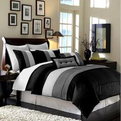 a black and white bed in a bedroom