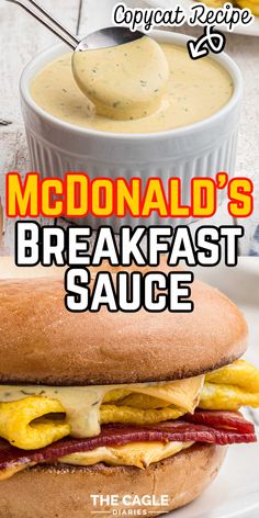 mcdonald's breakfast sauce on a sandwich with bacon and egg in the middle, next to a bowl of macaroni and cheese