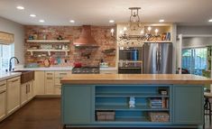 a large kitchen with an island in the middle