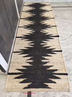 a black and white rug on the floor