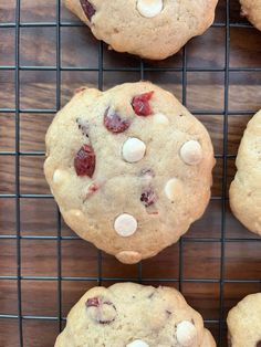 cookies with white chocolate chips and cranberries on a cooling rack