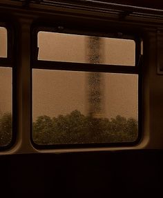 the eiffel tower seen from inside a train window