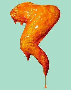 a piece of food that looks like an animal's body is dripping orange liquid