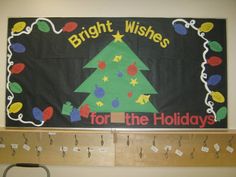 a bulletin board with a christmas tree on it and the words bright wishes for the holidays