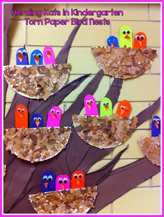 paper plate bird craft for kids to make with their own hands and fingers, on a bulletin board