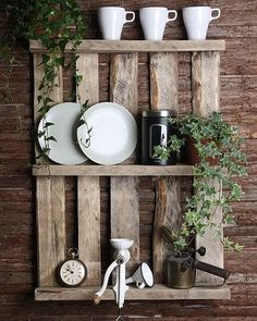 a wooden shelf with plates and cups on it