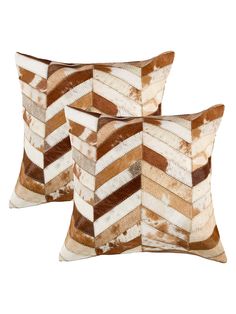 two brown and white pillows on a white background