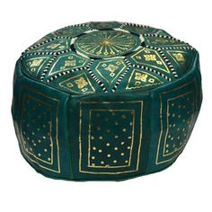 a green and gold ottoman sitting on top of a white floor