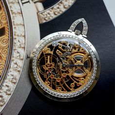 A vintage and rare Audemars Piguet skeletonized watch in 18k white gold, crafted during the 1970s. The 47.3 mm case features black enamel Roman numeral hour markers on the satin-finish bezel and is flanked by 60 diamonds, and the tapered bow contains 9 diamonds. The decorative engraving of the gold movement is fully seen on either sides; truly a masterpiece created by Audemars Piguet consisting of hours of meticulous craftsmanship in the openwork technique, simply complemented by blued-steel feu Vintage Pocket Watch, Blue Steel, Roman Numeral, Audemars Piguet, Roman Numerals, Black Enamel, Satin Finish, Pocket Watch, Accessories Watches