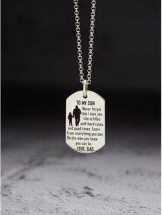 a dog tag with the words to my son on it is hanging from a chain