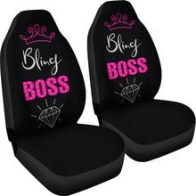 two black car seats with pink lettering and diamond on the front, one has a princess tia